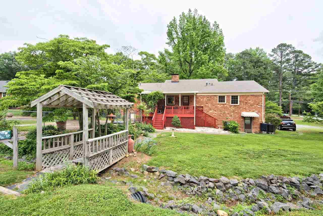 3607 Cole Mill Road Durham, NC 27712 - Photo 23 of 25 The Bridge way adds a unique feature to the yard and allows easy access to the large detached storage area. Bridge