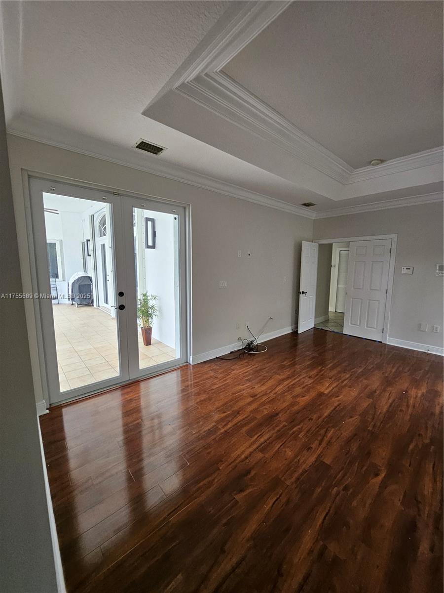 9491 Southwest 124th Terrace Miami, FL 33176 - Photo 19 of 26 wooden floor in a hall with an entryway