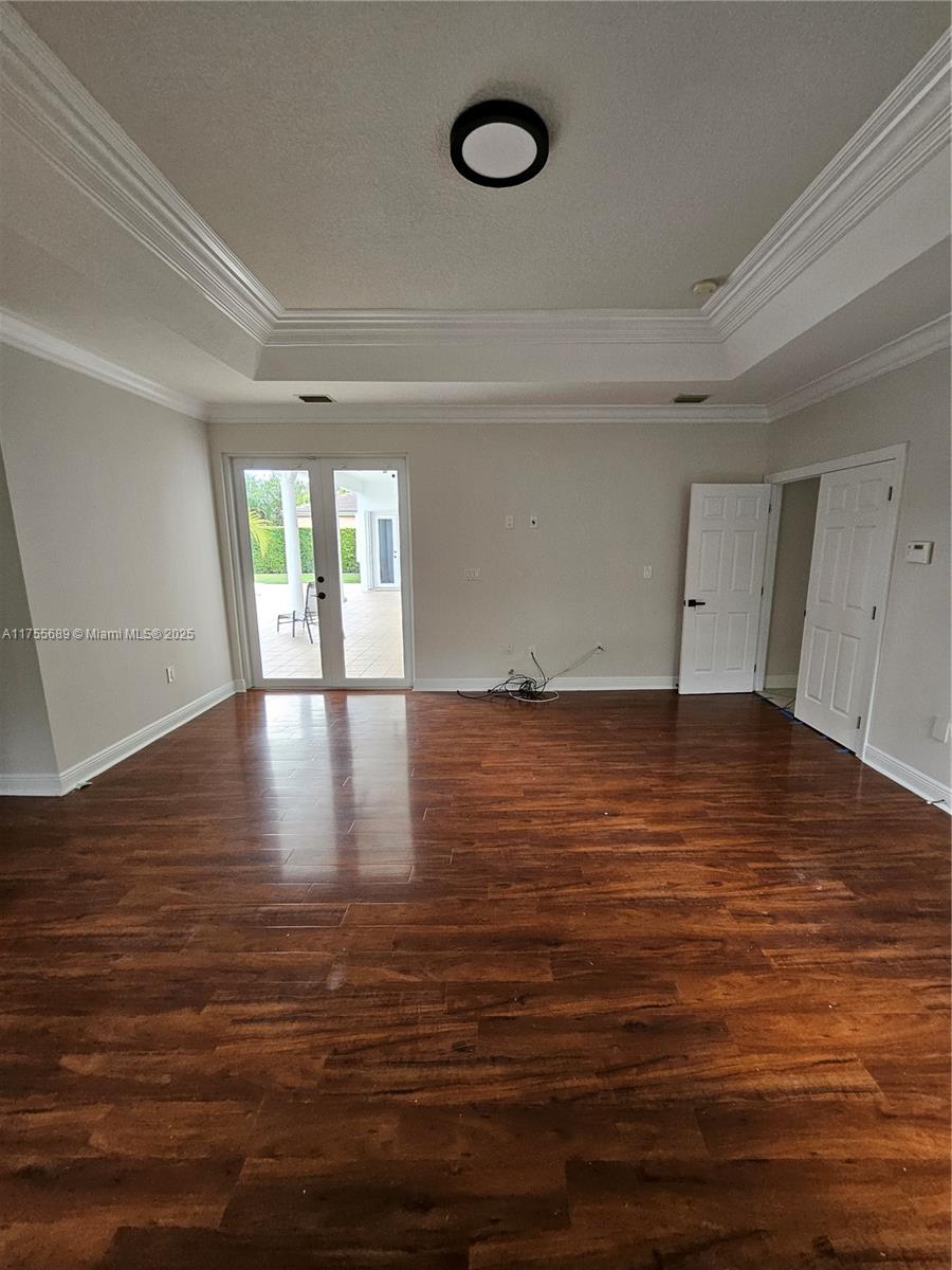 9491 Southwest 124th Terrace Miami, FL 33176 - Photo 20 of 26 a view of room with window and wooden floor
