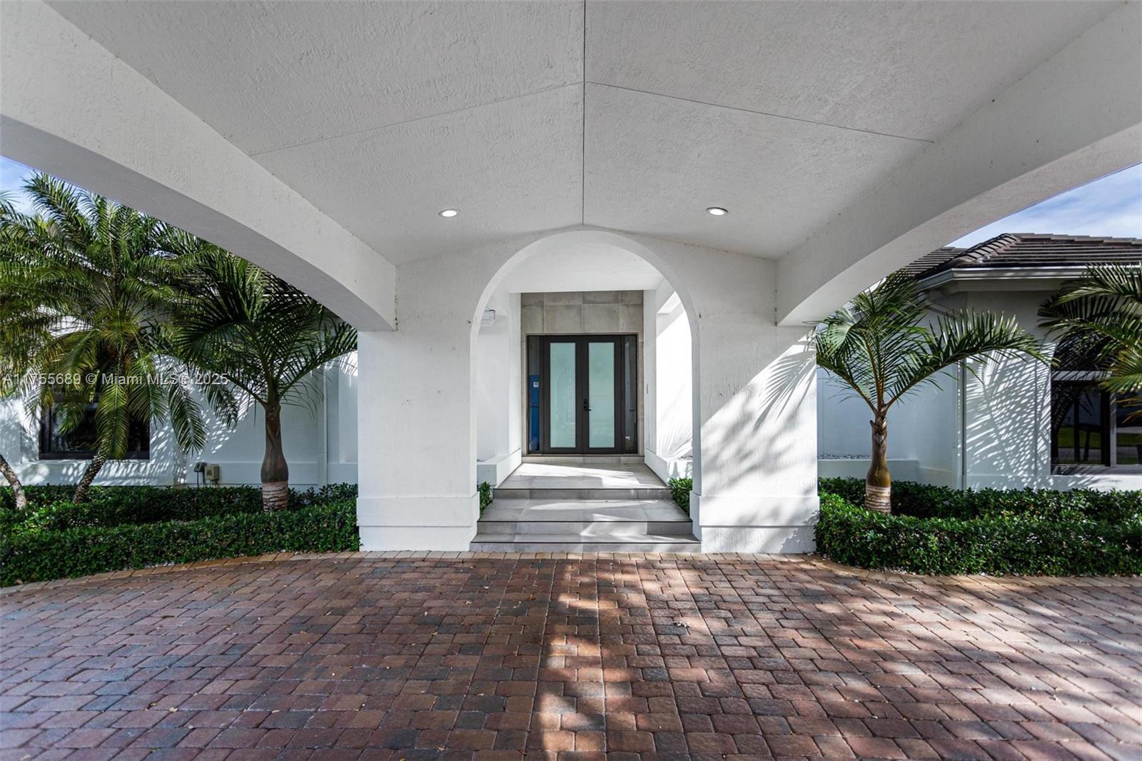 9491 Southwest 124th Terrace Miami, FL 33176 - Photo 4 of 26 a front view of a house with garden