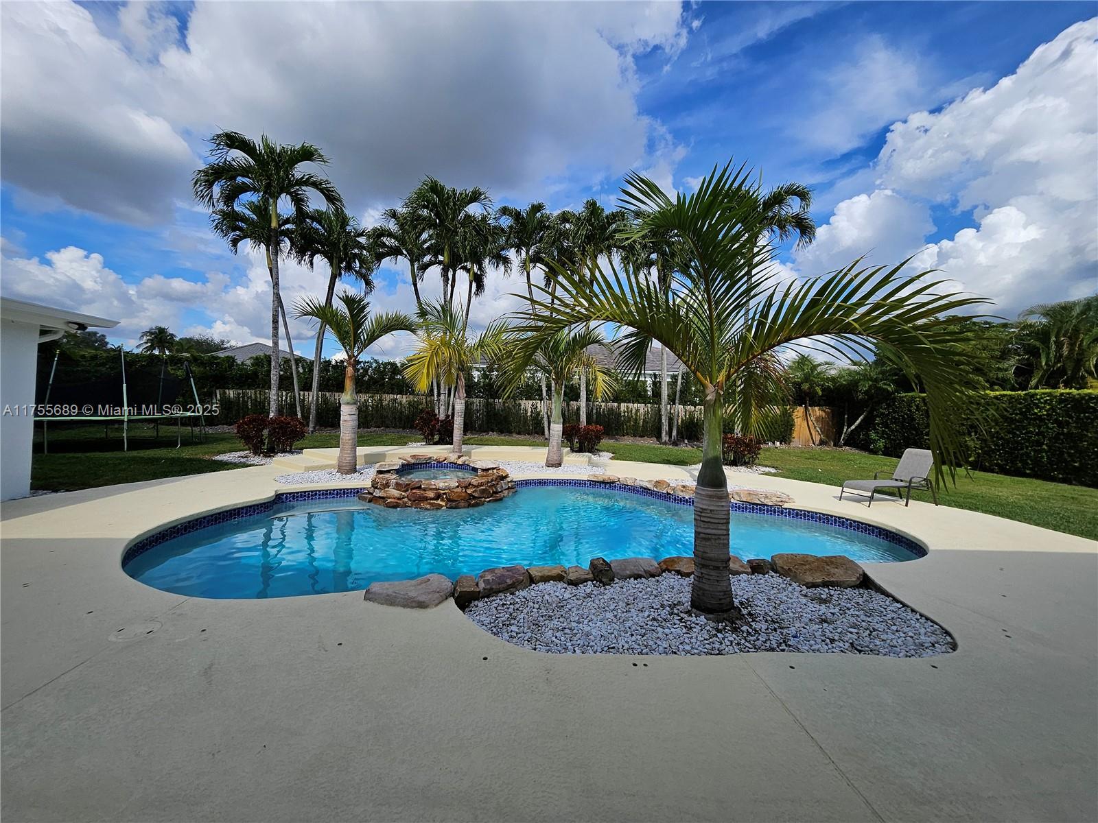 9491 Southwest 124th Terrace Miami, FL 33176 - Photo 8 of 26 a view of a backyard with swimming pool