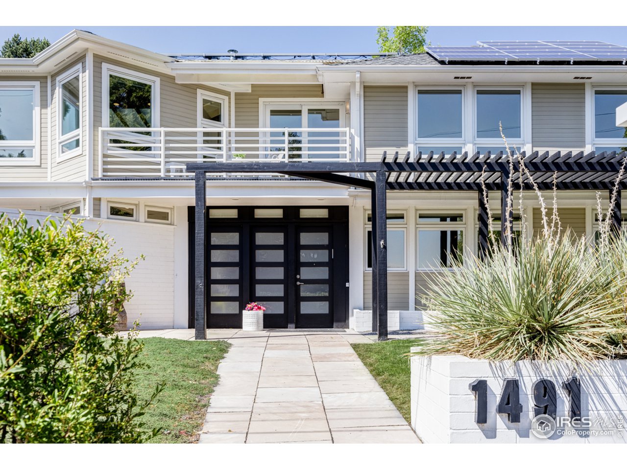 1491 High Street Boulder, CO 80304 - Photo 1 of 40 a front view of a house with a garden