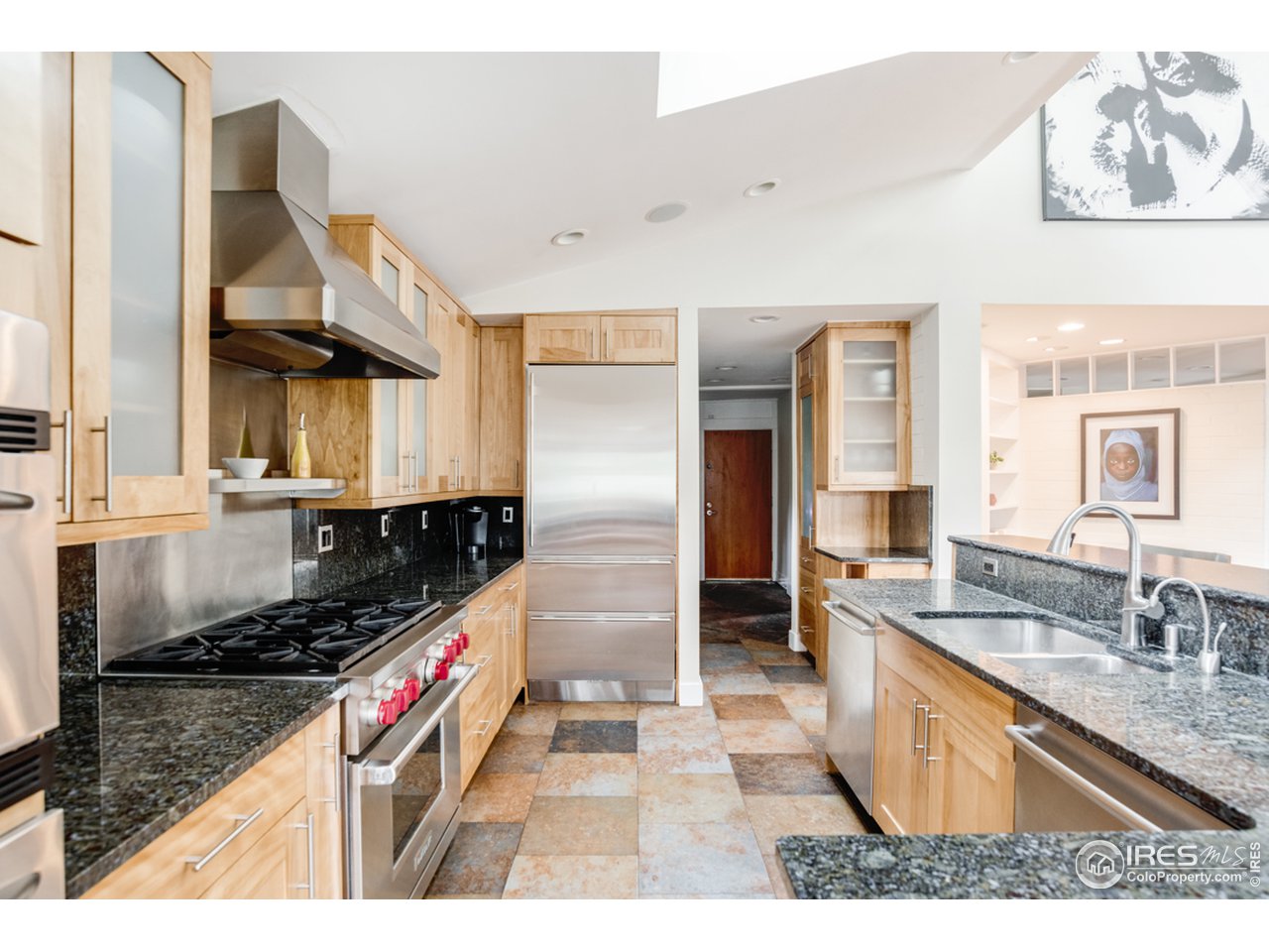 1491 High Street Boulder, CO 80304 - Photo 16 of 40 a kitchen with stainless steel appliances granite countertop a sink stove and refrigerator