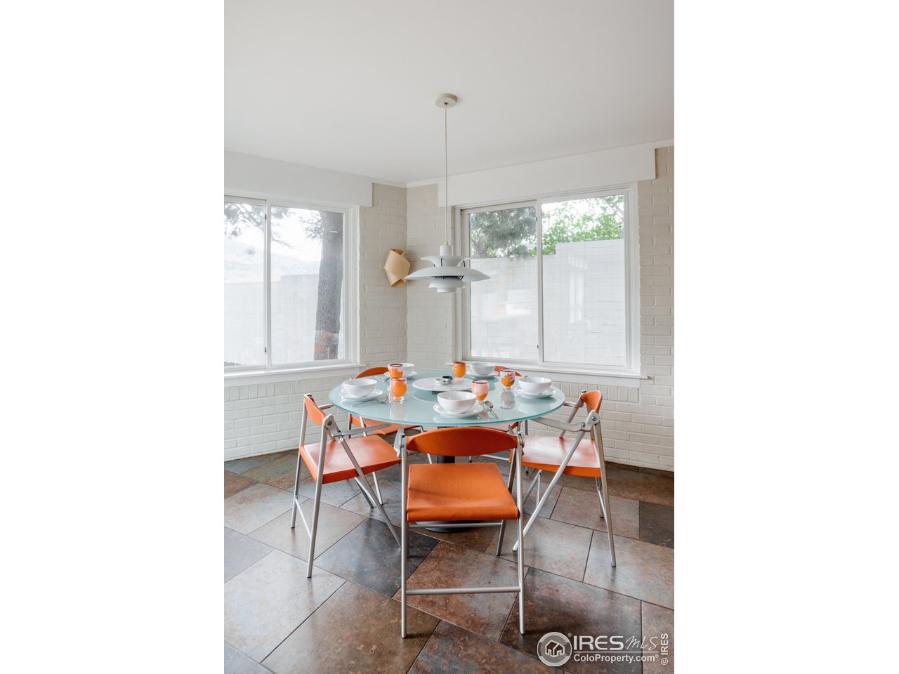 1491 High Street Boulder, CO 80304 - Photo 18 of 40 a dining room with furniture and a chandelier