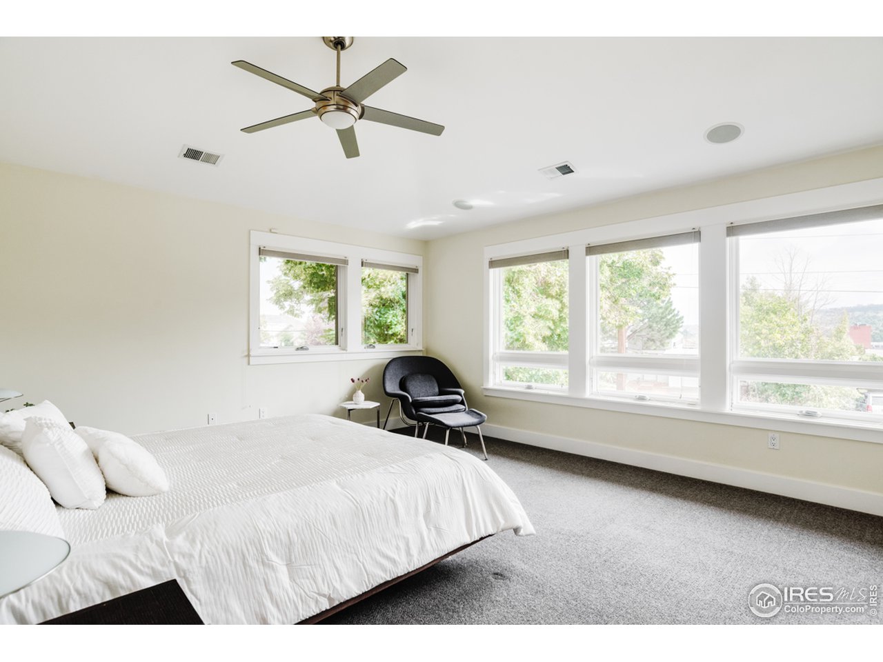 1491 High Street Boulder, CO 80304 - Photo 21 of 40 a bedroom with a bed and a large window with the outer view