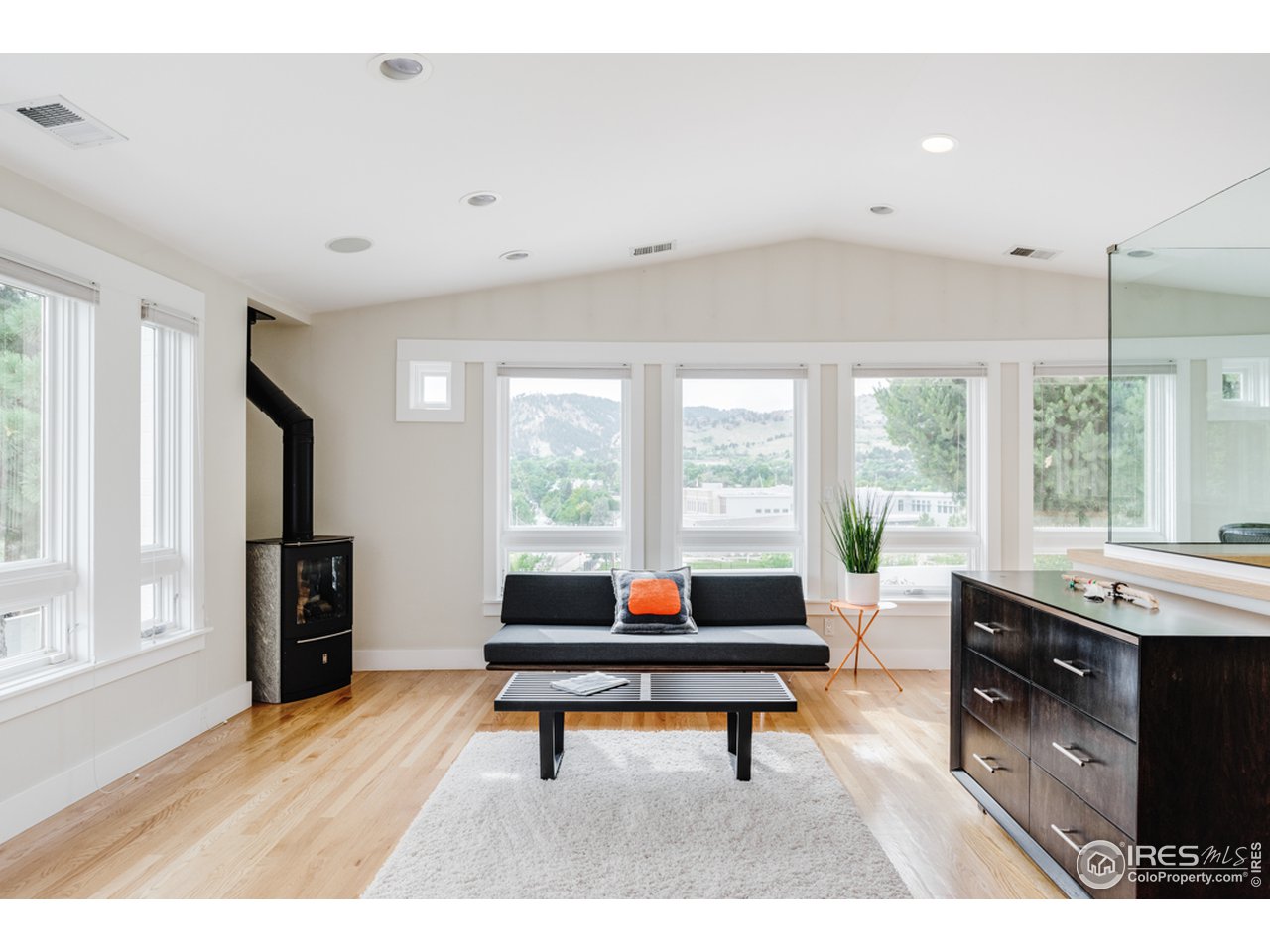 1491 High Street Boulder, CO 80304 - Photo 25 of 40 a living room with furniture a rug and a floor to ceiling window