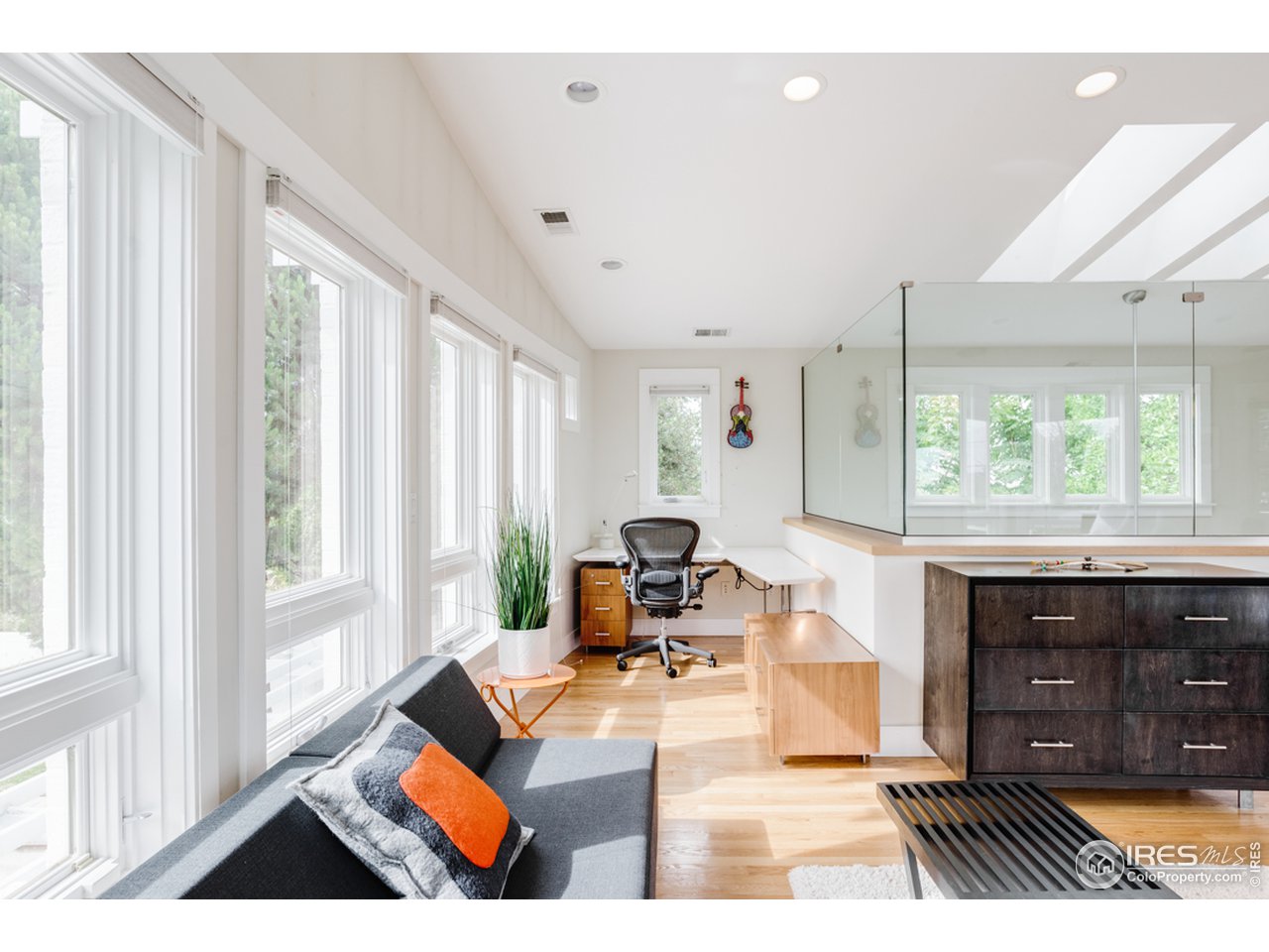 1491 High Street Boulder, CO 80304 - Photo 27 of 40 a living room with furniture and a fireplace