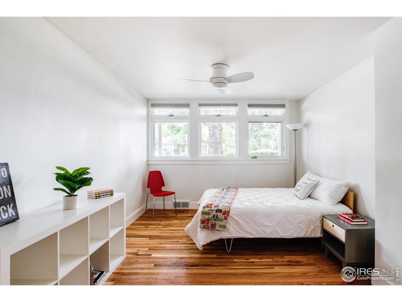 1491 High Street Boulder, CO 80304 - Photo 30 of 40 a bedroom with a bed and a potted plant