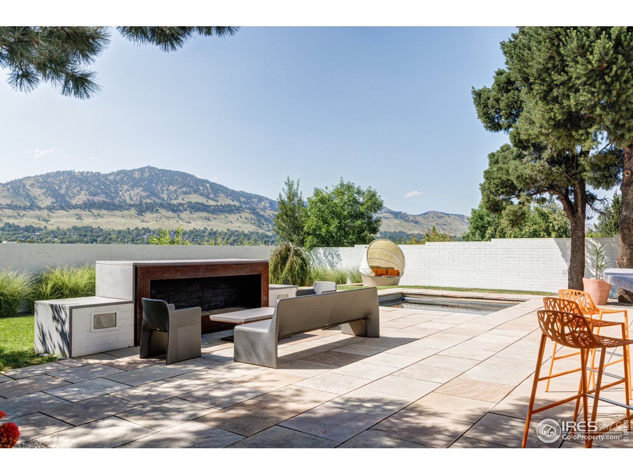 1491 High Street Boulder, CO 80304 - Photo 3 of 40 a view of a terrace with couches and a fire pit