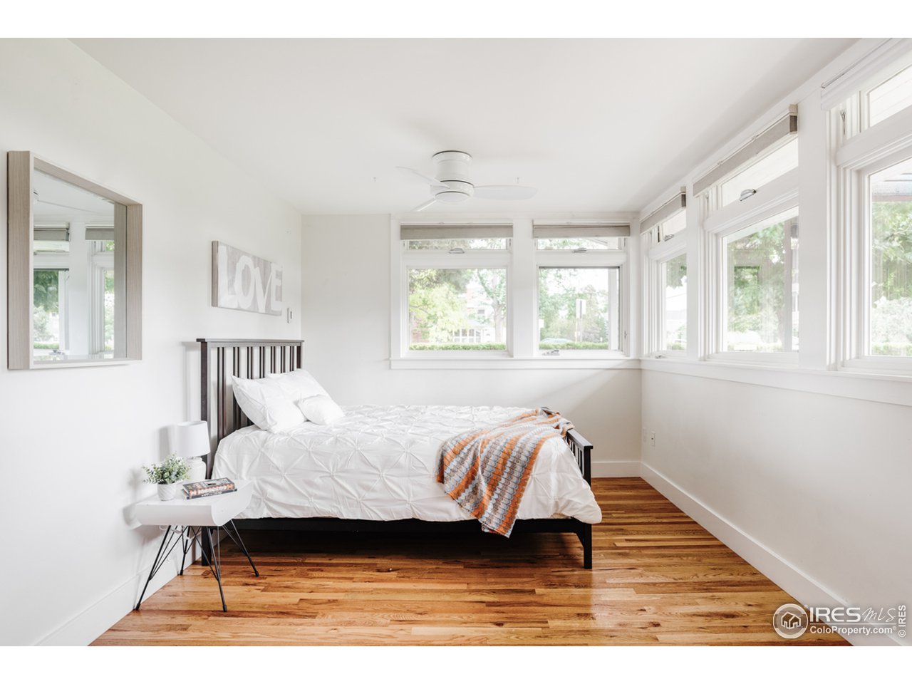 1491 High Street Boulder, CO 80304 - Photo 31 of 40 a living room with a bed furniture and a window