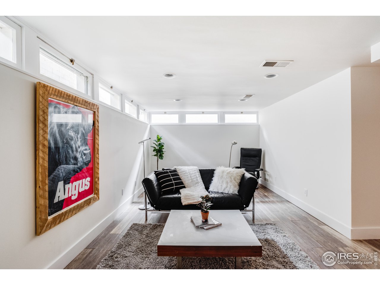 1491 High Street Boulder, CO 80304 - Photo 35 of 40 a living room with furniture and wooden floor