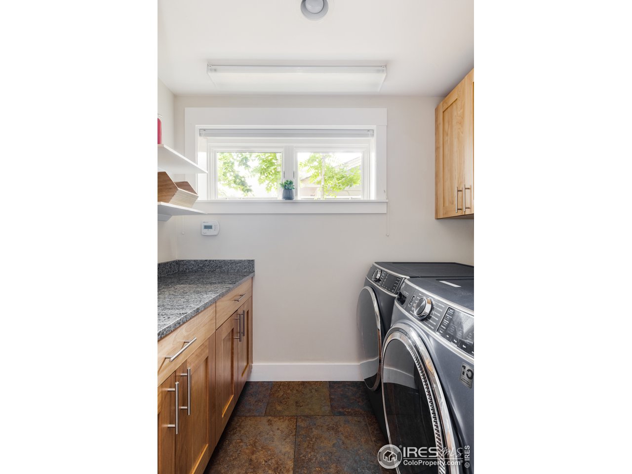 1491 High Street Boulder, CO 80304 - Photo 37 of 40 a utility room with dryer and washer