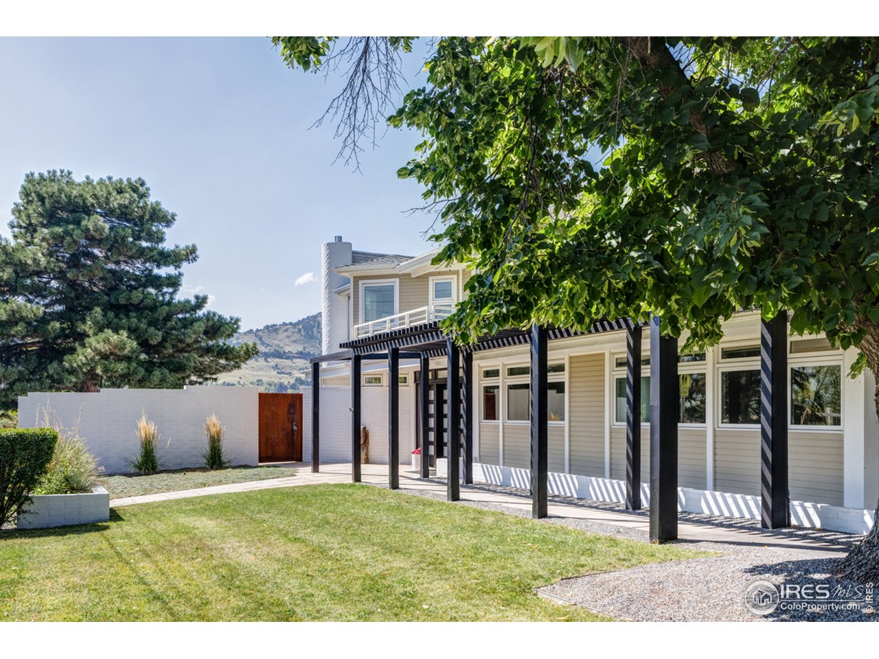 1491 High Street Boulder, CO 80304 - Photo 5 of 40 a view of a house with backyard and a tree