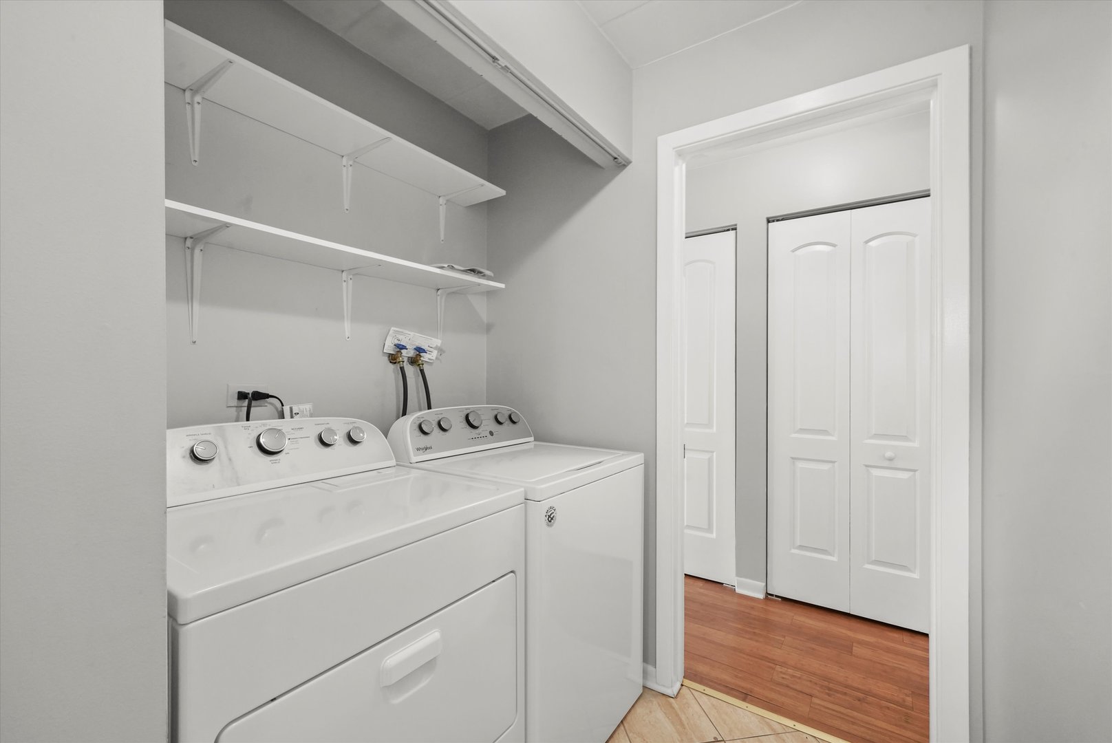 4240 North Keystone Avenue, Unit 2D Chicago, IL 60641 - Photo 15 of 18 a utility room with dryer and washer