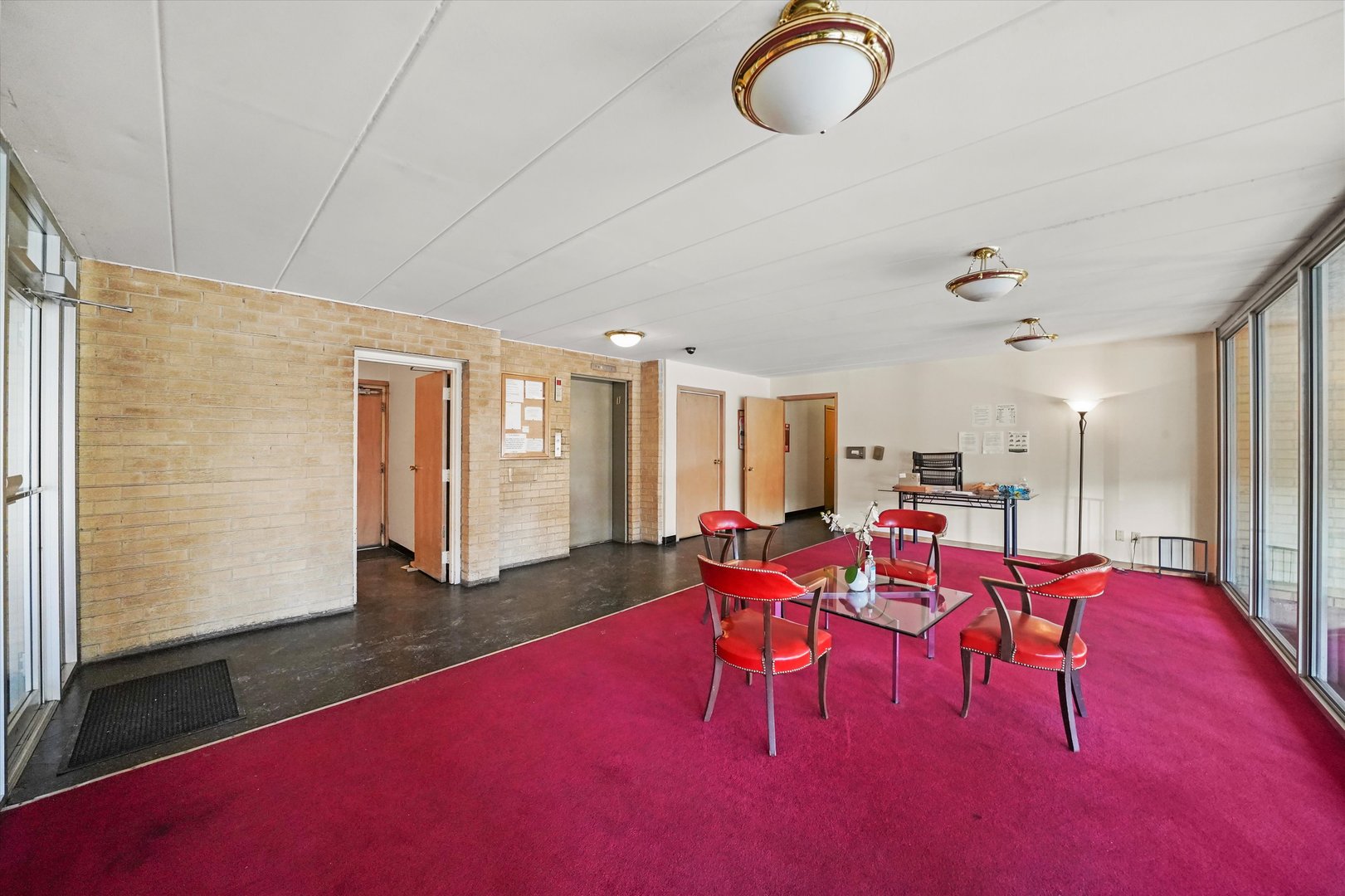 4240 North Keystone Avenue, Unit 2D Chicago, IL 60641 - Photo 16 of 18 an open kitchen with dining table and chairs