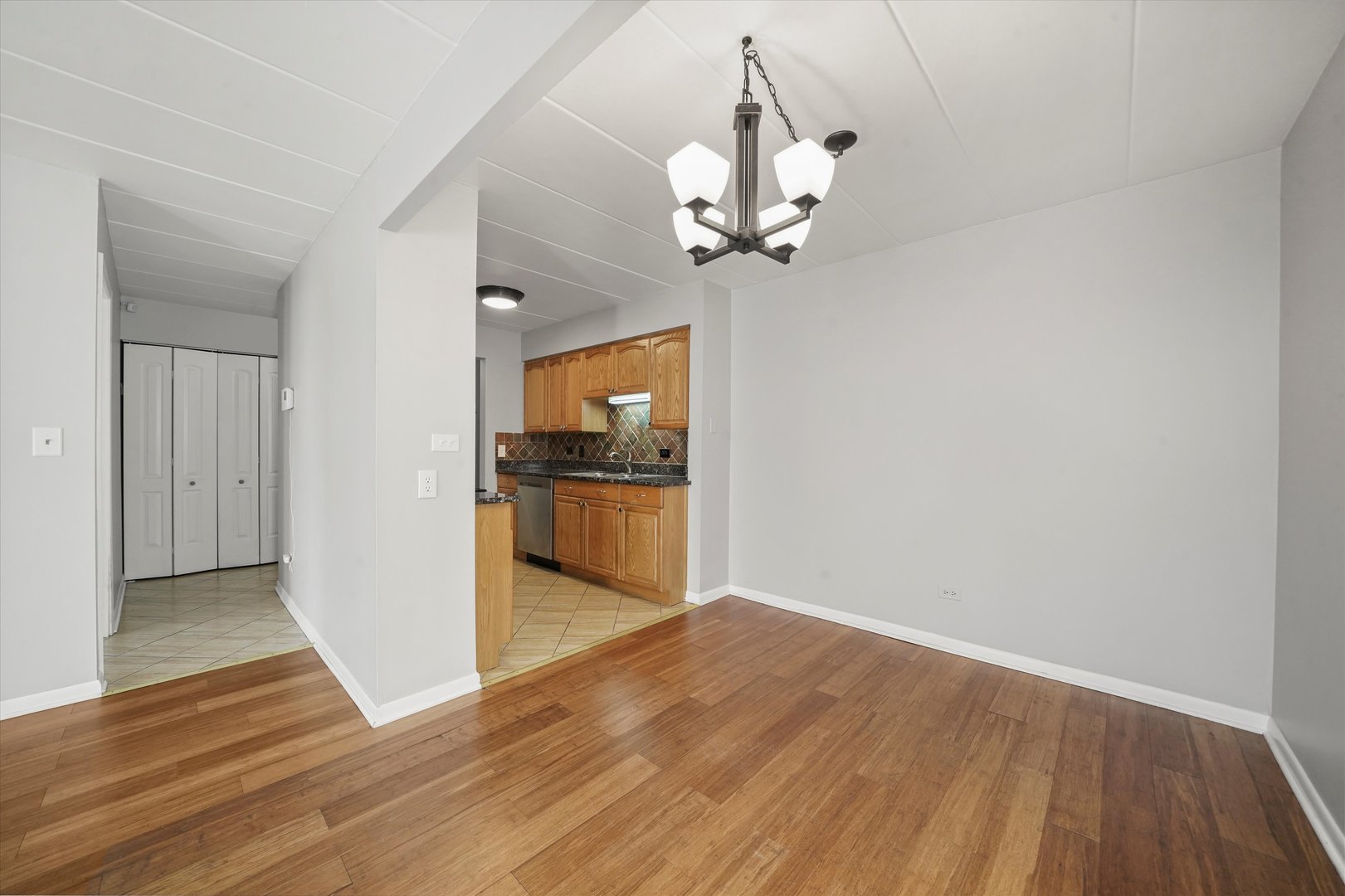 4240 North Keystone Avenue, Unit 2D Chicago, IL 60641 - Photo 6 of 18 a view of a kitchen with a sink and wooden floor