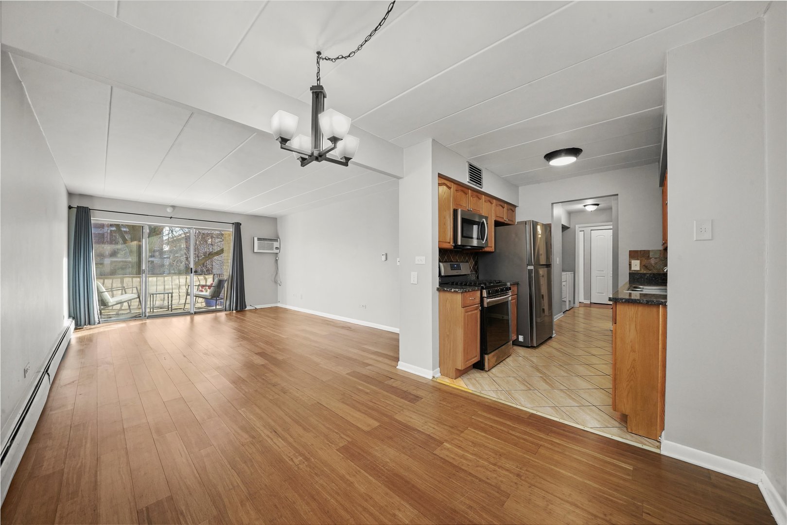 4240 North Keystone Avenue, Unit 2D Chicago, IL 60641 - Photo 7 of 18 a view of a kitchen with a sink and a refrigerator