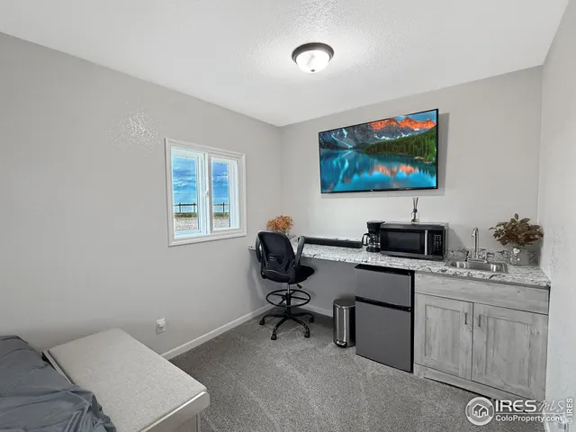 a view of a workspace with furniture