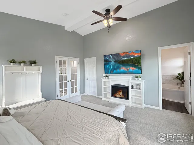 a bedroom with a bed and a fireplace