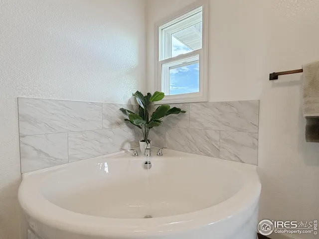 a white bath tub sitting in a bathroom