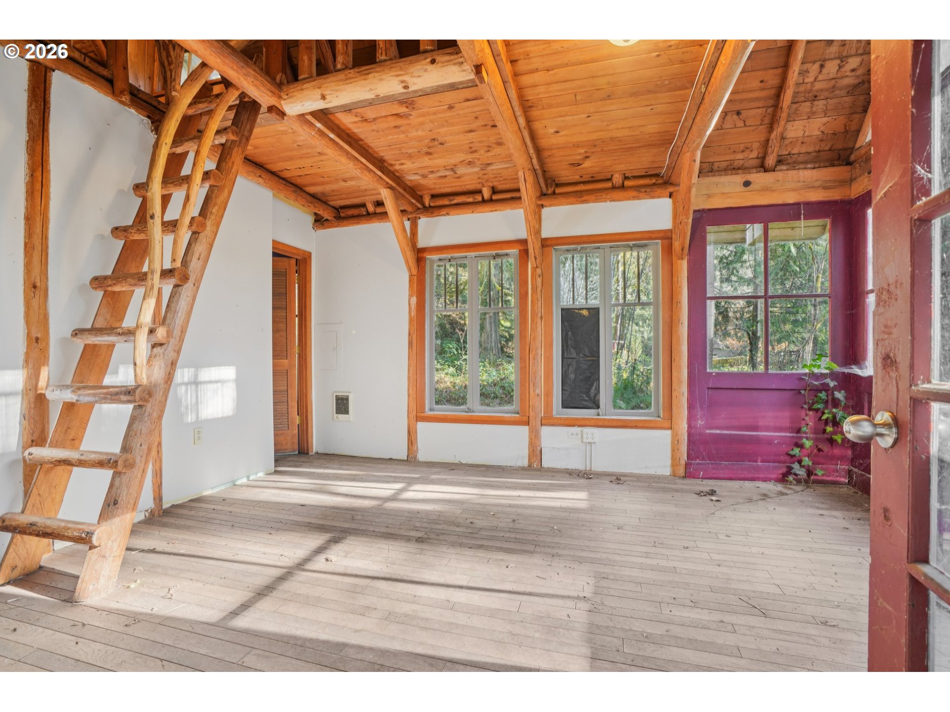 63875 East Barlow Trail Road Rhododendron, OR 97049 - Photo 4 of 17 a living room with a large window