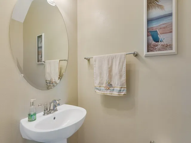 a bathroom with a sink and mirror