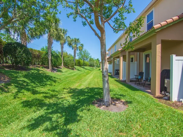 a backyard of a house with lots of green space