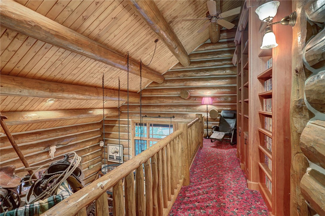 1381 Johnson Road Silverthorne, CO 80498 - Photo 22 of 35 To the right of the loft, you will find this walkway that overlooks the kitchen. Enjoy this reading nook with a large built in book shelf!