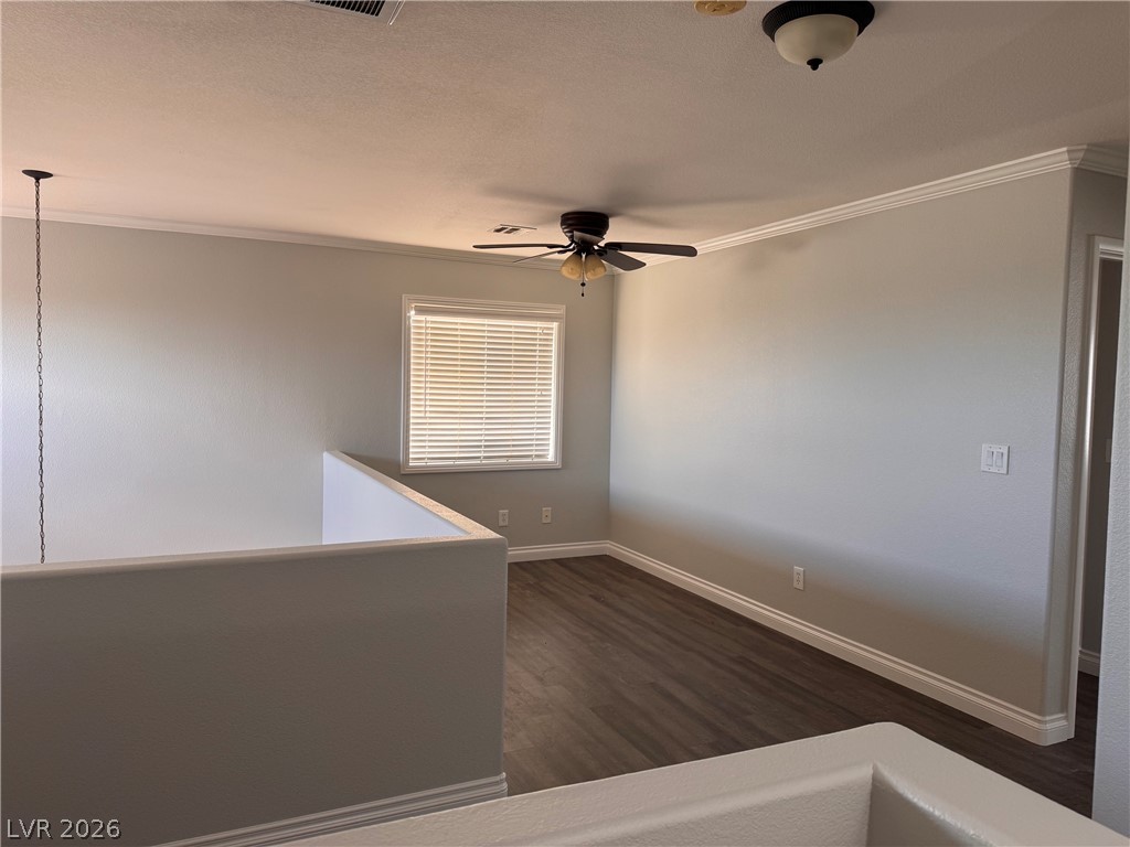 8937 Austin Ridge Avenue Las Vegas, NV 89178 - Photo 11 of 22 An inviting open loft space with wood-look flooring and a ceiling fan provides versatile living.
