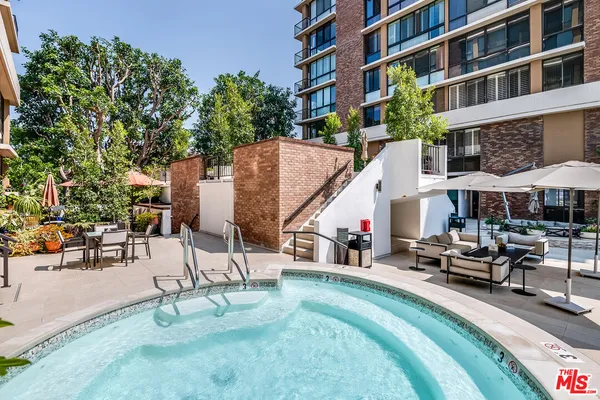 a view of a swimming pool with a lounge chair