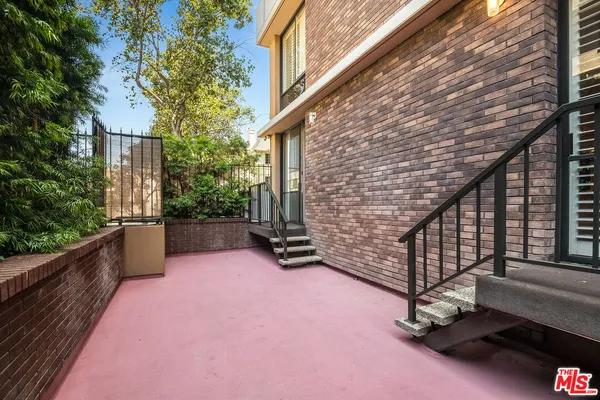 a balcony with trees