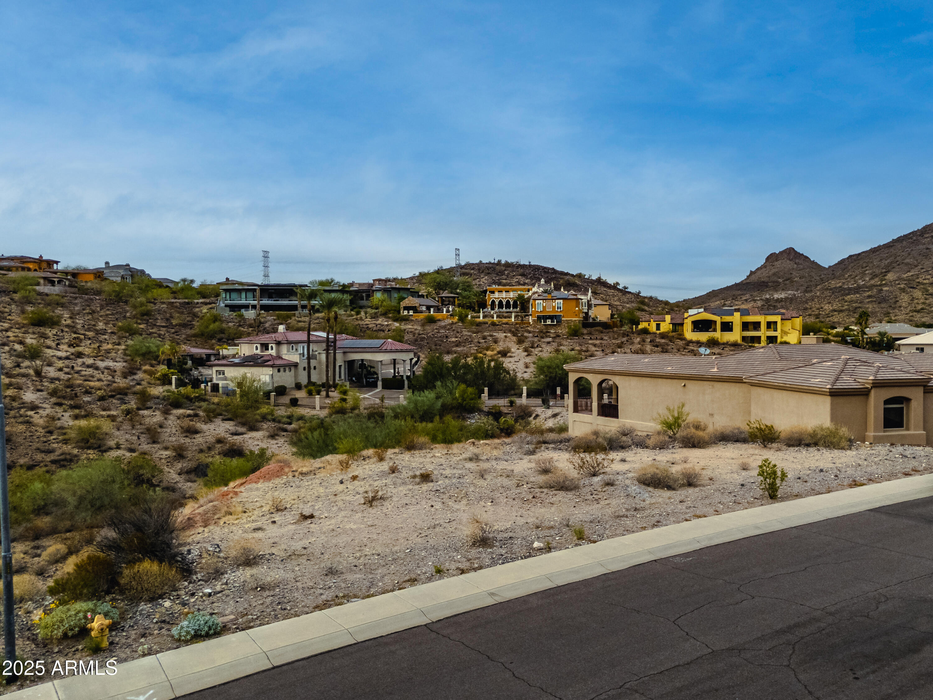 6152 West Alameda Road, Unit 11 Glendale, AZ 85310 - Photo 13 of 20 a view of a house with a snow on the road