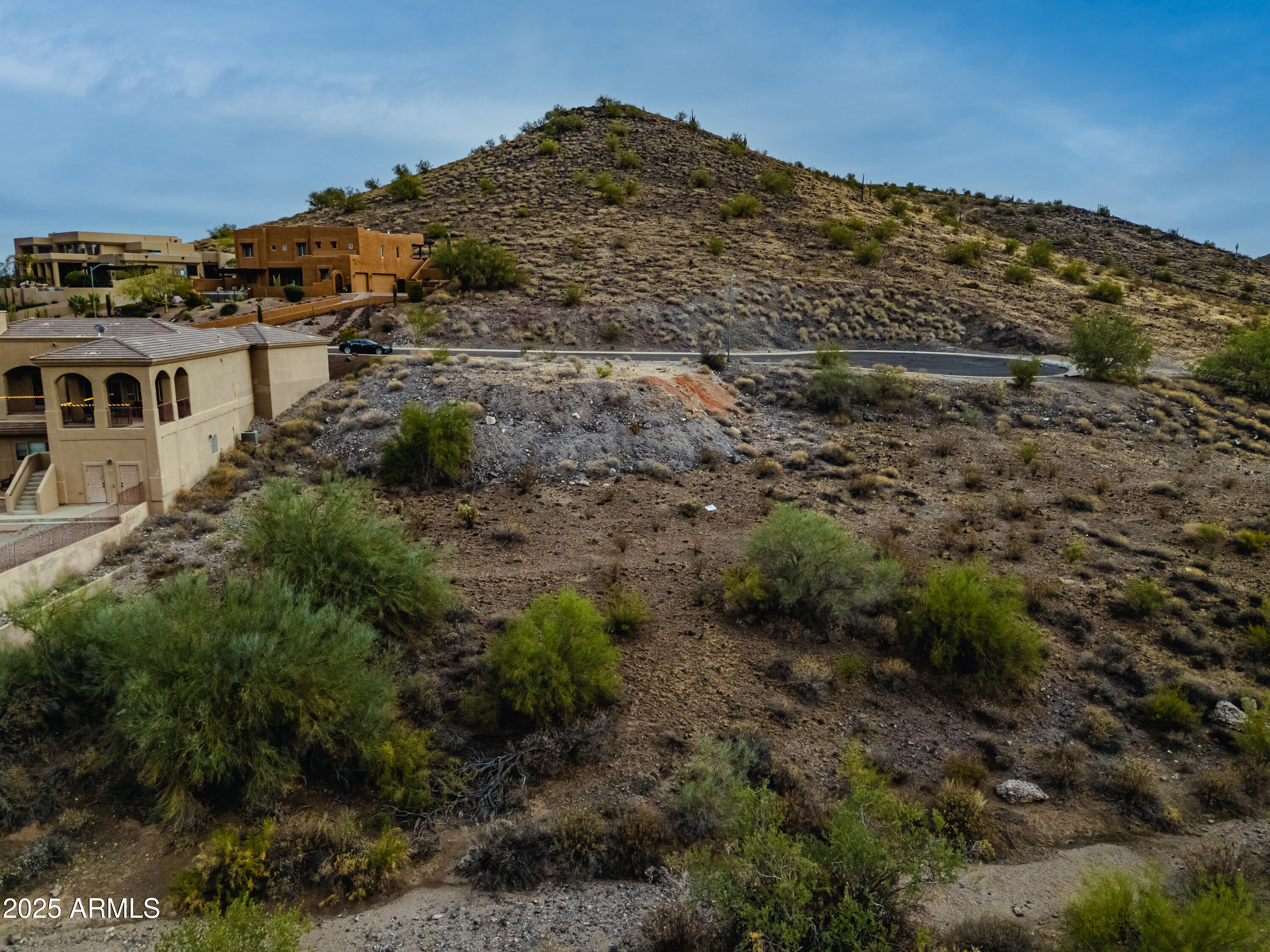 6152 West Alameda Road, Unit 11 Glendale, AZ 85310 - Photo 5 of 20 a view of a large building with a mountain in the background