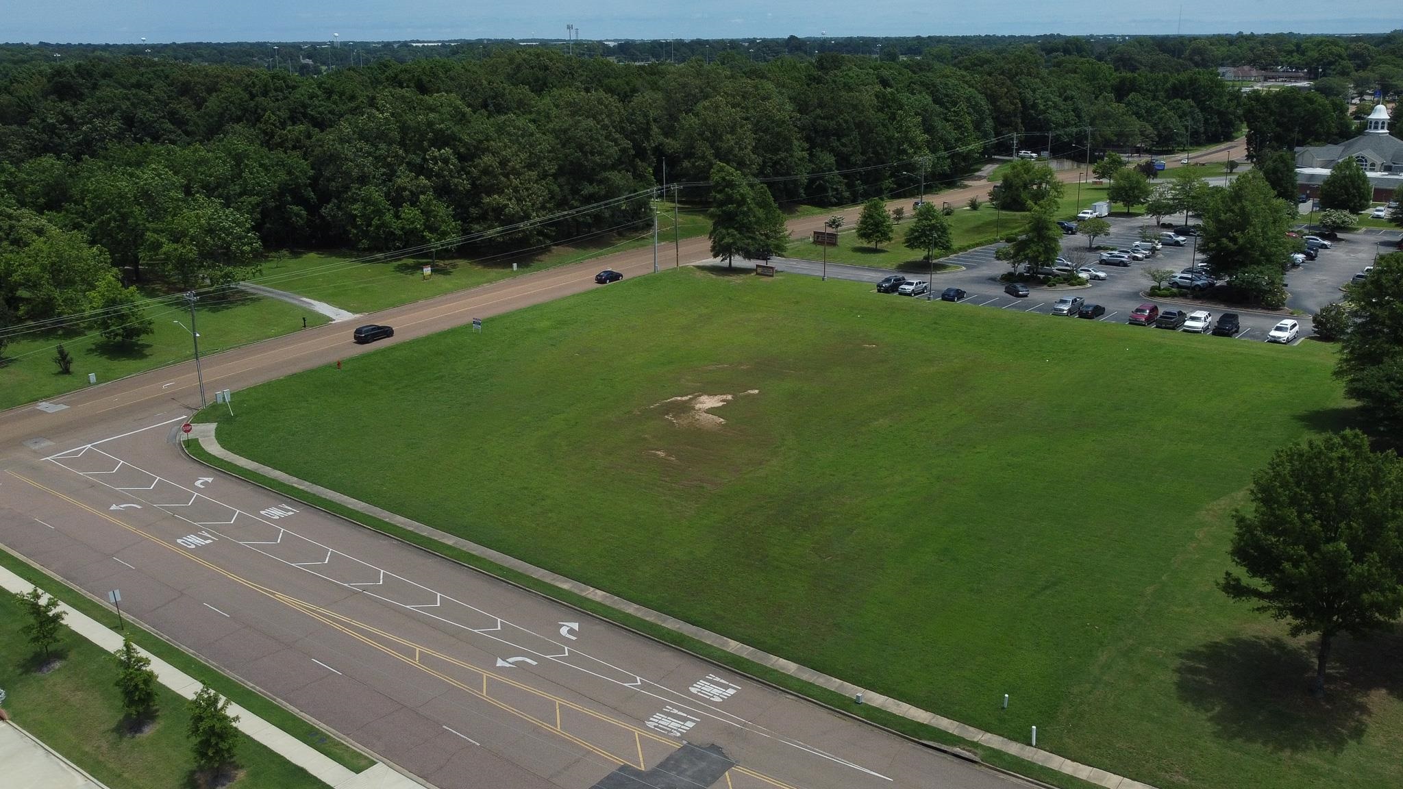 Lot 3 Old Goodman Road Olive Branch, MS 38654 - Photo 4 of 11 a view of a green field with benches