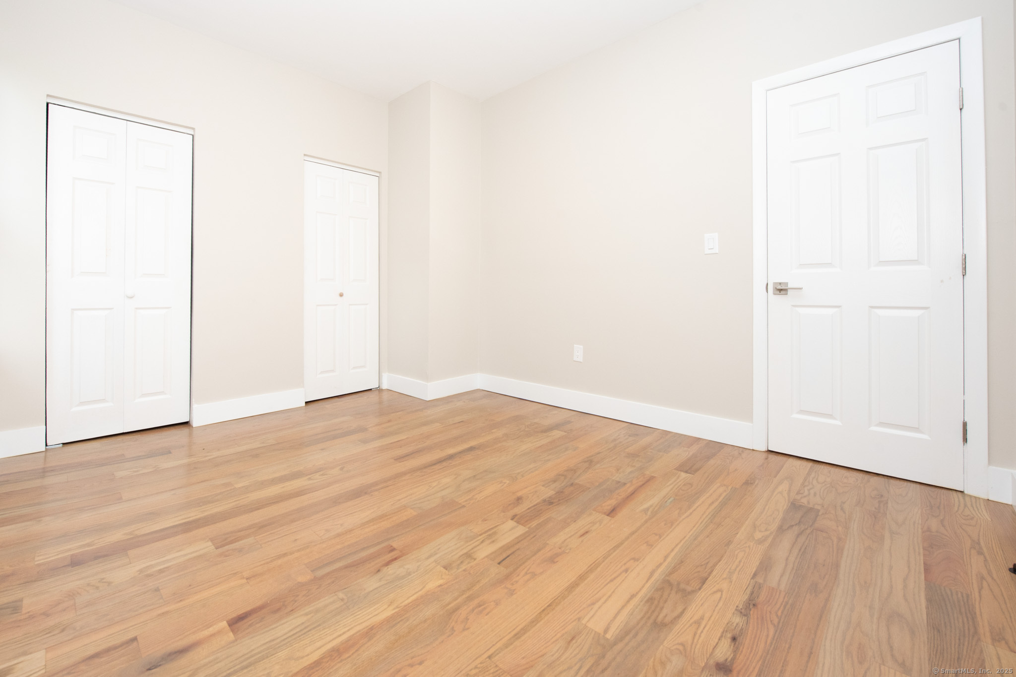 527 East Main Street Bridgeport, CT 06608 - Photo 11 of 25 an empty room with wooden floor