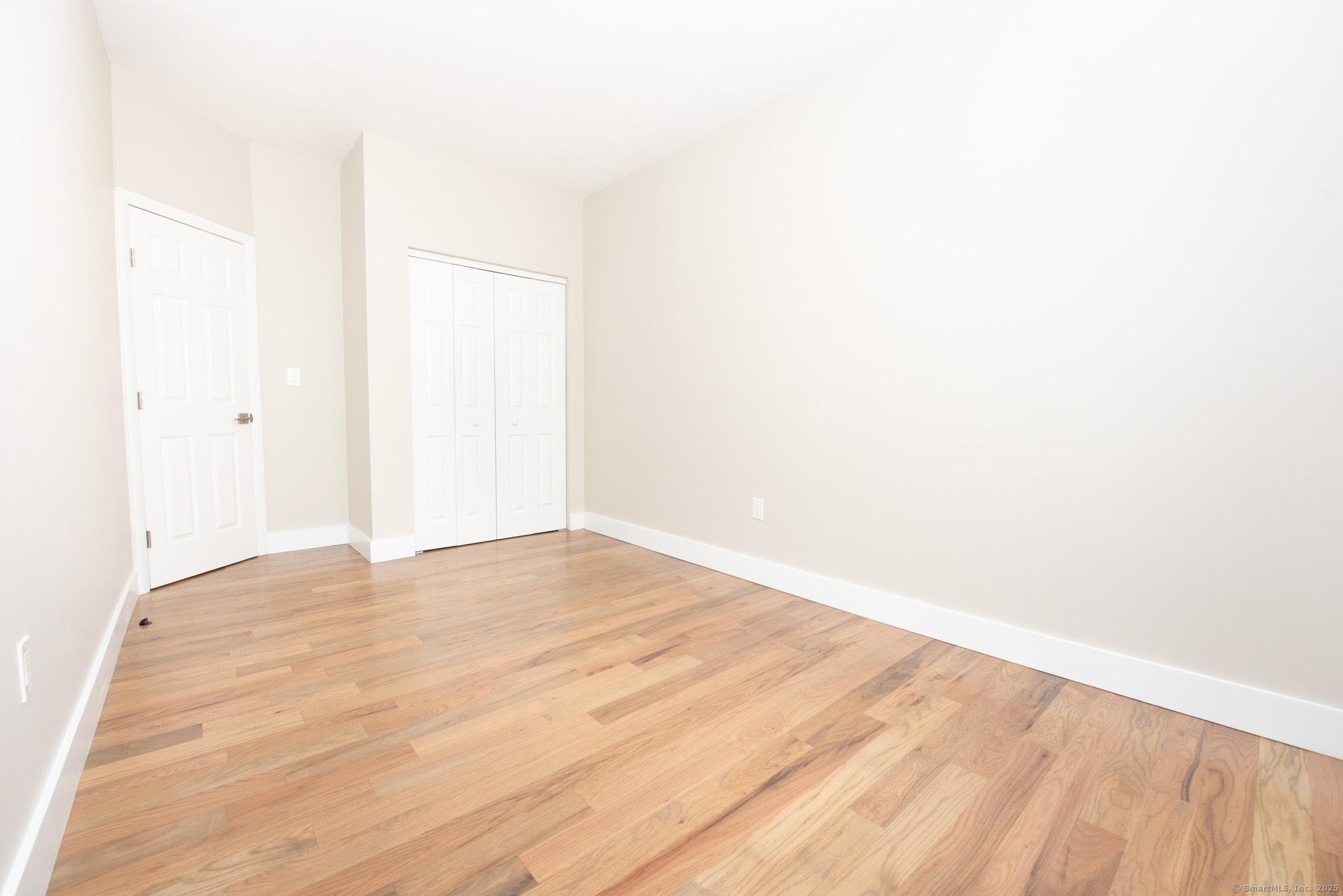527 East Main Street Bridgeport, CT 06608 - Photo 19 of 25 a view of empty room with wooden floor