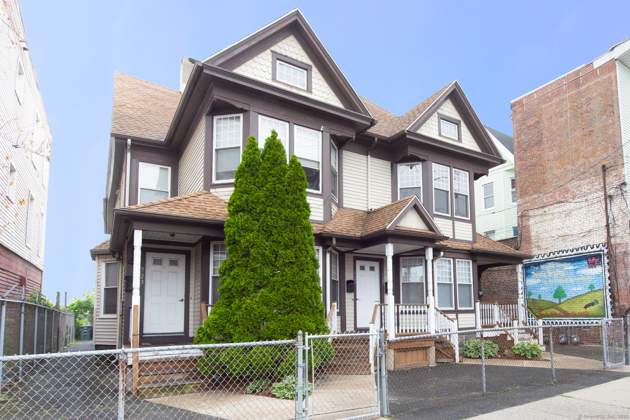 527 East Main Street Bridgeport, CT 06608 - Photo 24 of 25 a front view of a house with porch