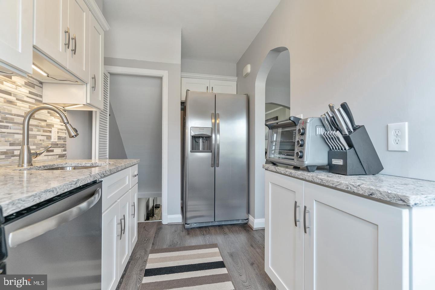 1067 Elm Road Halethorpe, MD 21227 - Photo 14 of 32 a kitchen with stainless steel appliances granite countertop a refrigerator and a sink