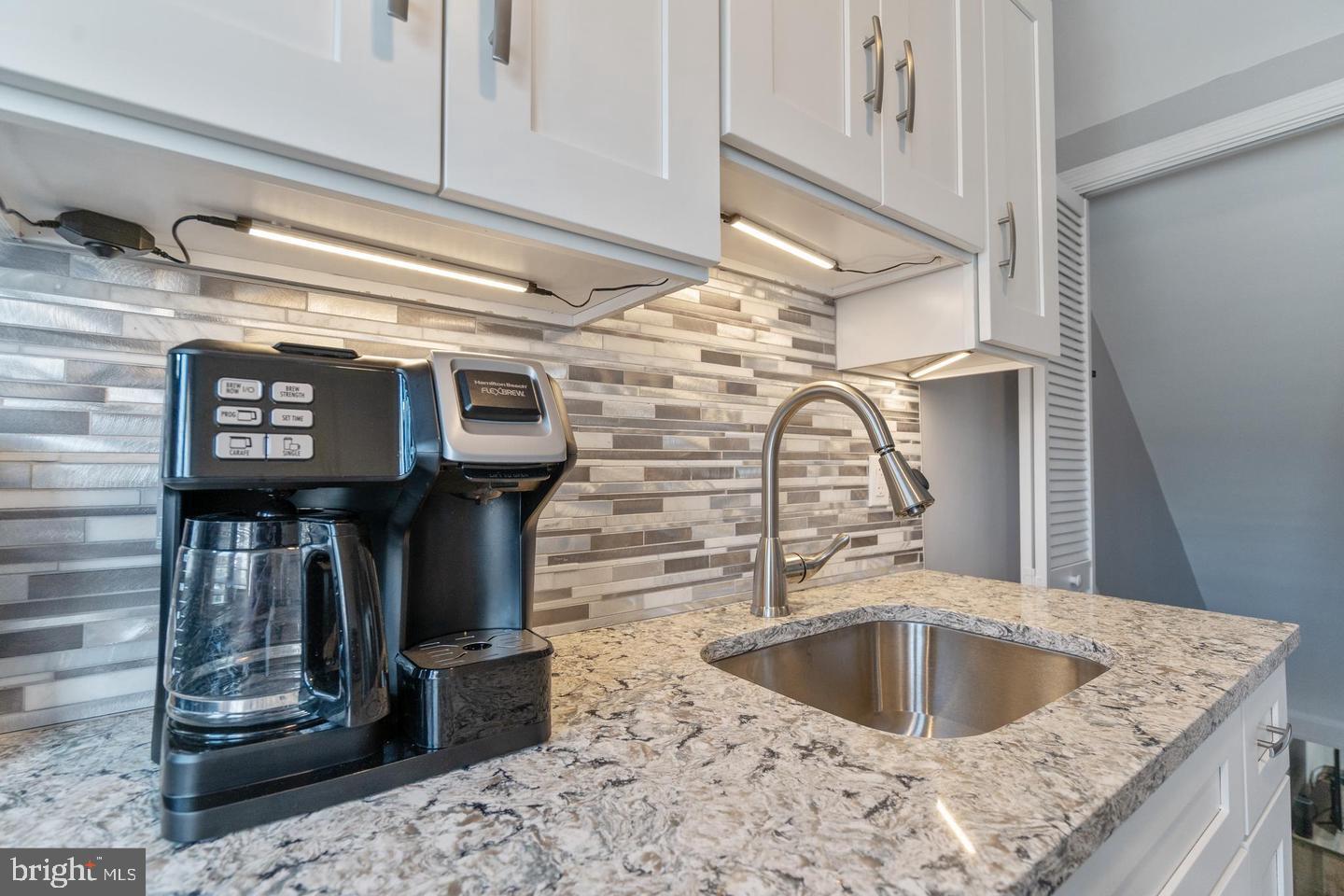 1067 Elm Road Halethorpe, MD 21227 - Photo 15 of 32 a kitchen with a sink and a refrigerator