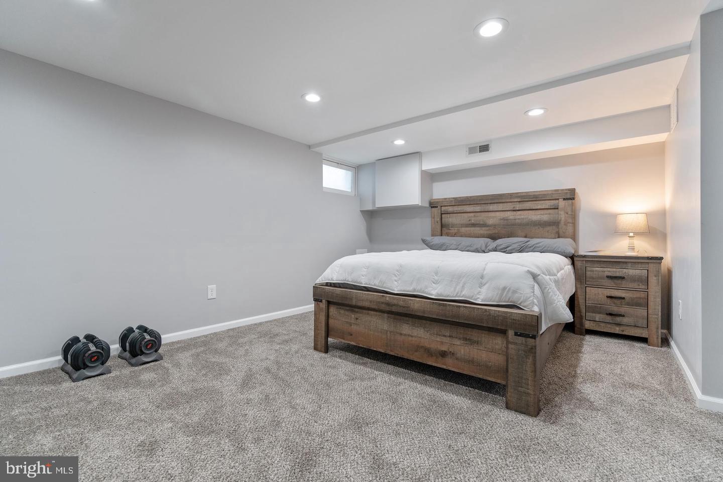 1067 Elm Road Halethorpe, MD 21227 - Photo 17 of 32 a bedroom with a bed and a chair