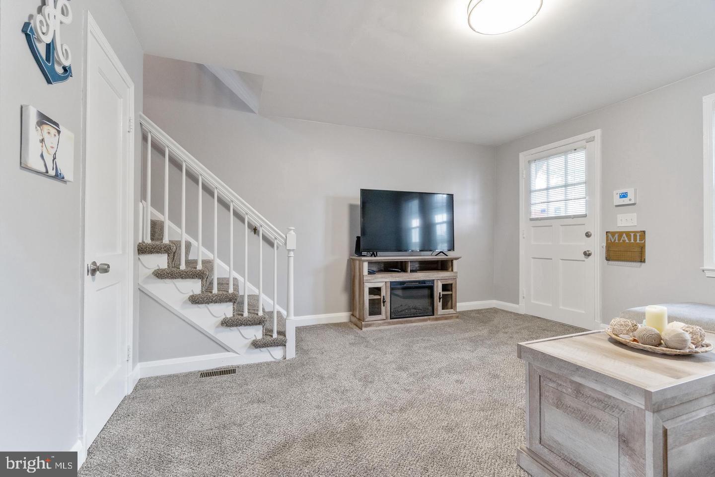 1067 Elm Road Halethorpe, MD 21227 - Photo 7 of 32 a view of livingroom with furniture flat screen tv and windows