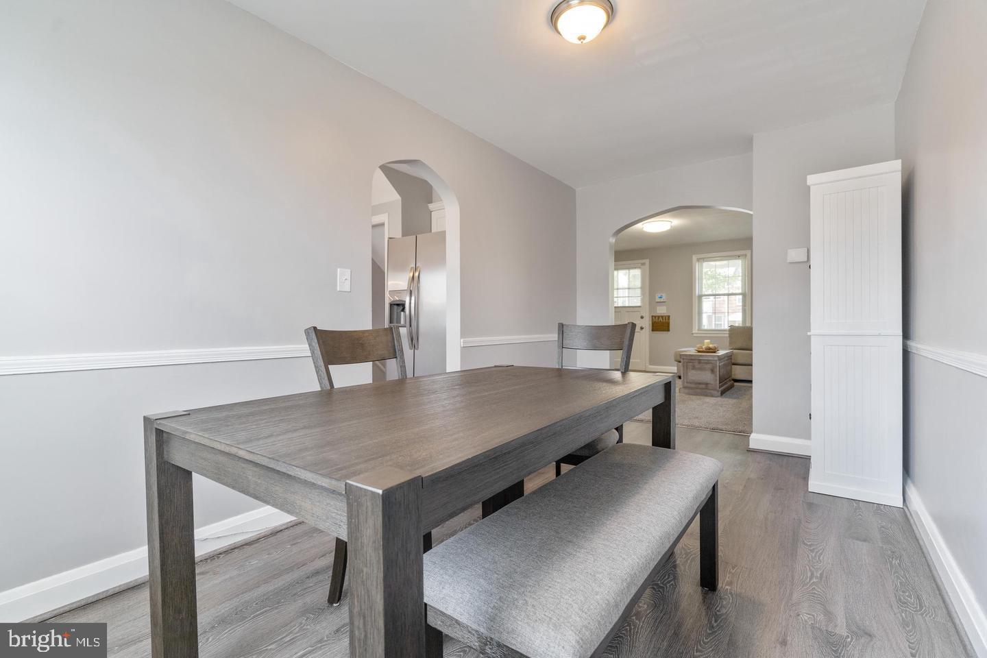1067 Elm Road Halethorpe, MD 21227 - Photo 10 of 32 a dining room with furniture and wooden floor