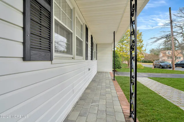 a view of a pathway both side of the house
