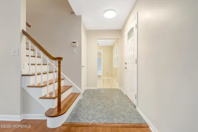 wooden floor with white walls