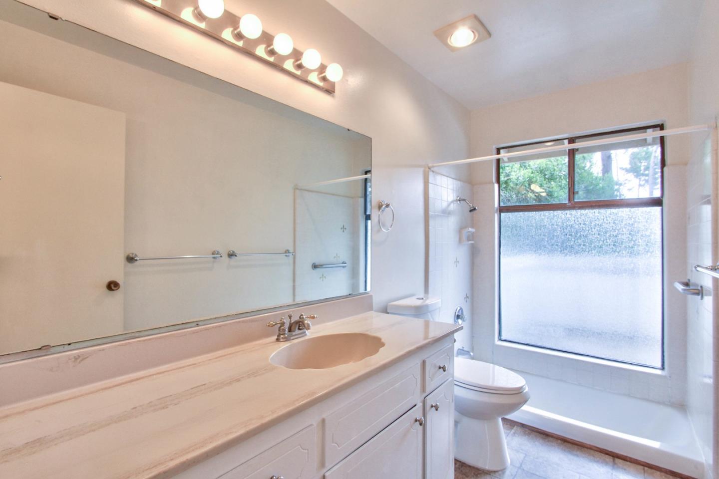 4025 Costado Road Pebble Beach, CA 93953 - Photo 10 of 21 a bathroom with a sink a toilet and shower