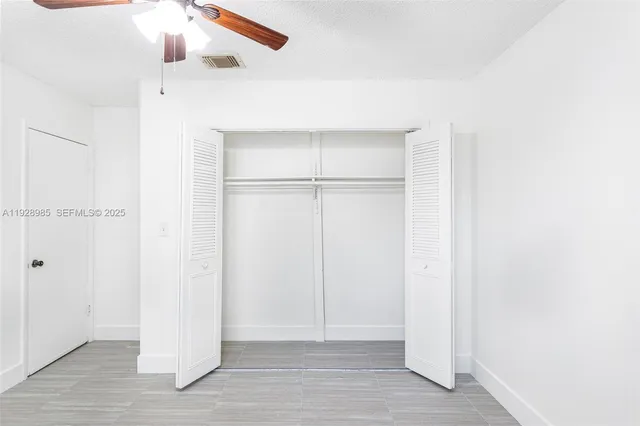 a view of storage and utility room with racks on the wall
