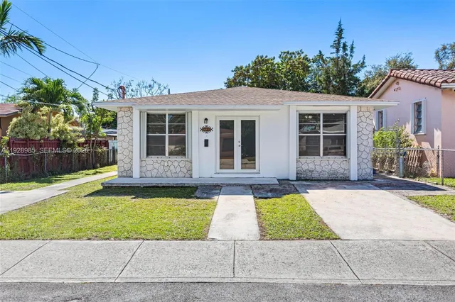 an aerial view of residential houses and outdoor space