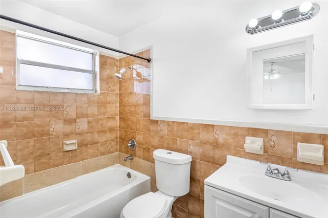 a bathroom with a sink a toilet and a bathtub