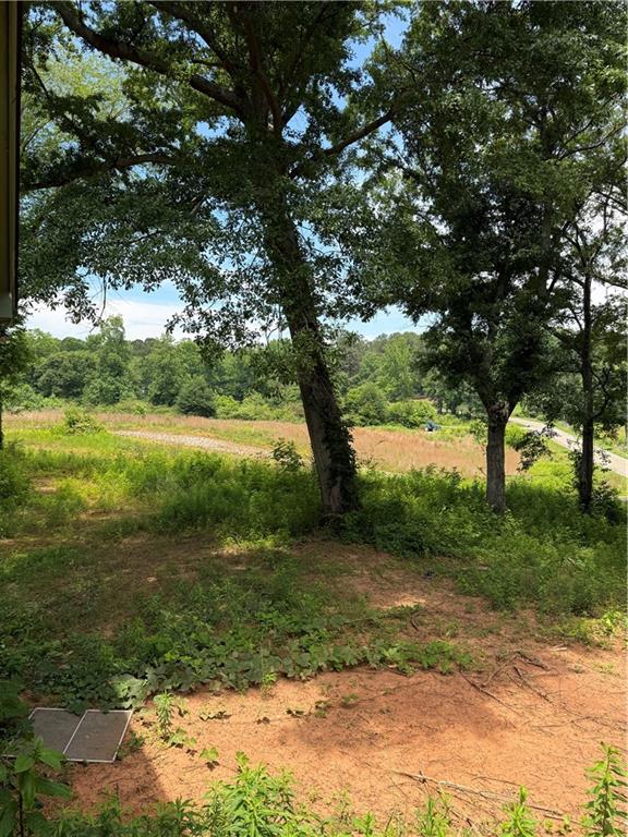 5075 Karr Road Cumming, GA 30040 - Photo 26 of 38 a view of a lake with a yard
