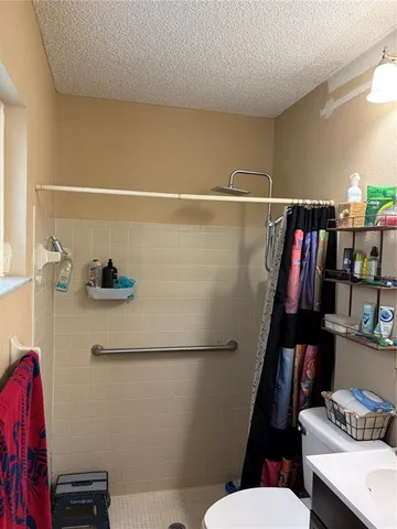 a view of swimming pool with a yard and sitting area